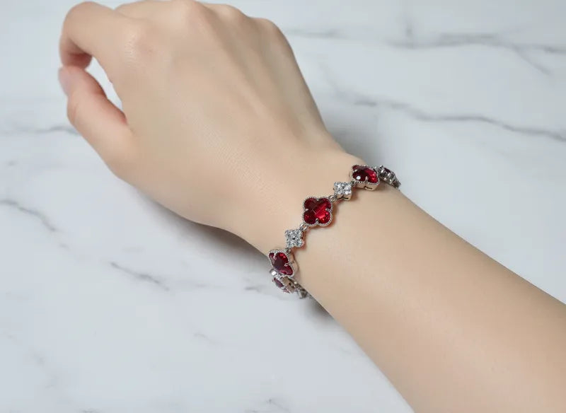 WHG RED CRYSTAL CLOVER TENNIS BRACELET