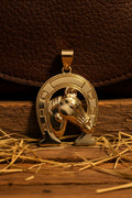 14K HORSE IN HORSESHOE PENDANT