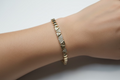 14K BRACAELET FEATURING A PAVE CUBIC ZIRCONIA TRIANGLE CENTER SECTION