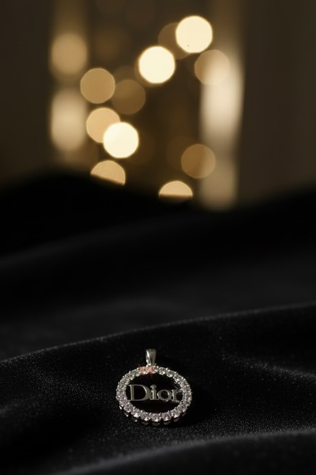 WHG DIOR LOGO INSP CLEAR CIRCULAR CHARM PENDANT