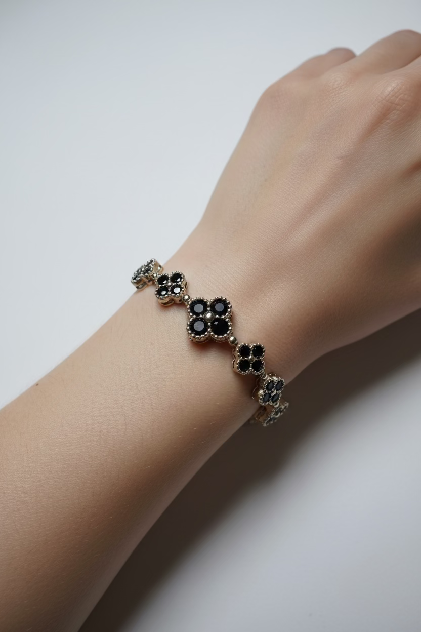 14K GRADUATED BLACK CLOVER TENNIS BRACELET