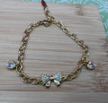 14K BOW WITH HEARTS BRACELET