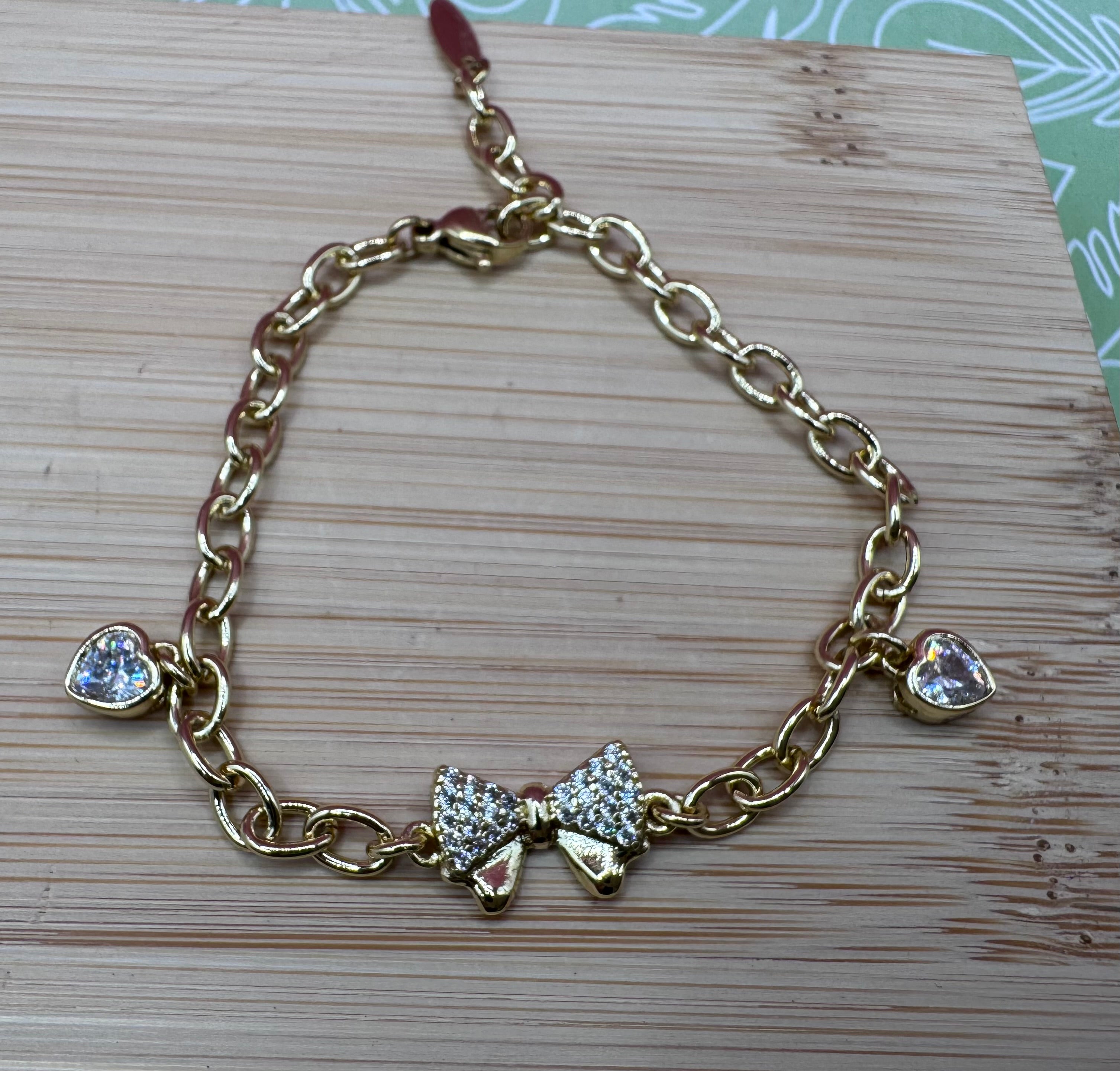 14K BOW WITH HEARTS BRACELET
