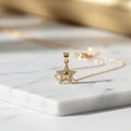 14K STAR SHAPED PENDANT CM
