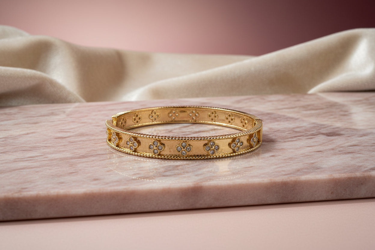 14K BANGLE BRACELET WITH DETAILED DESIGN