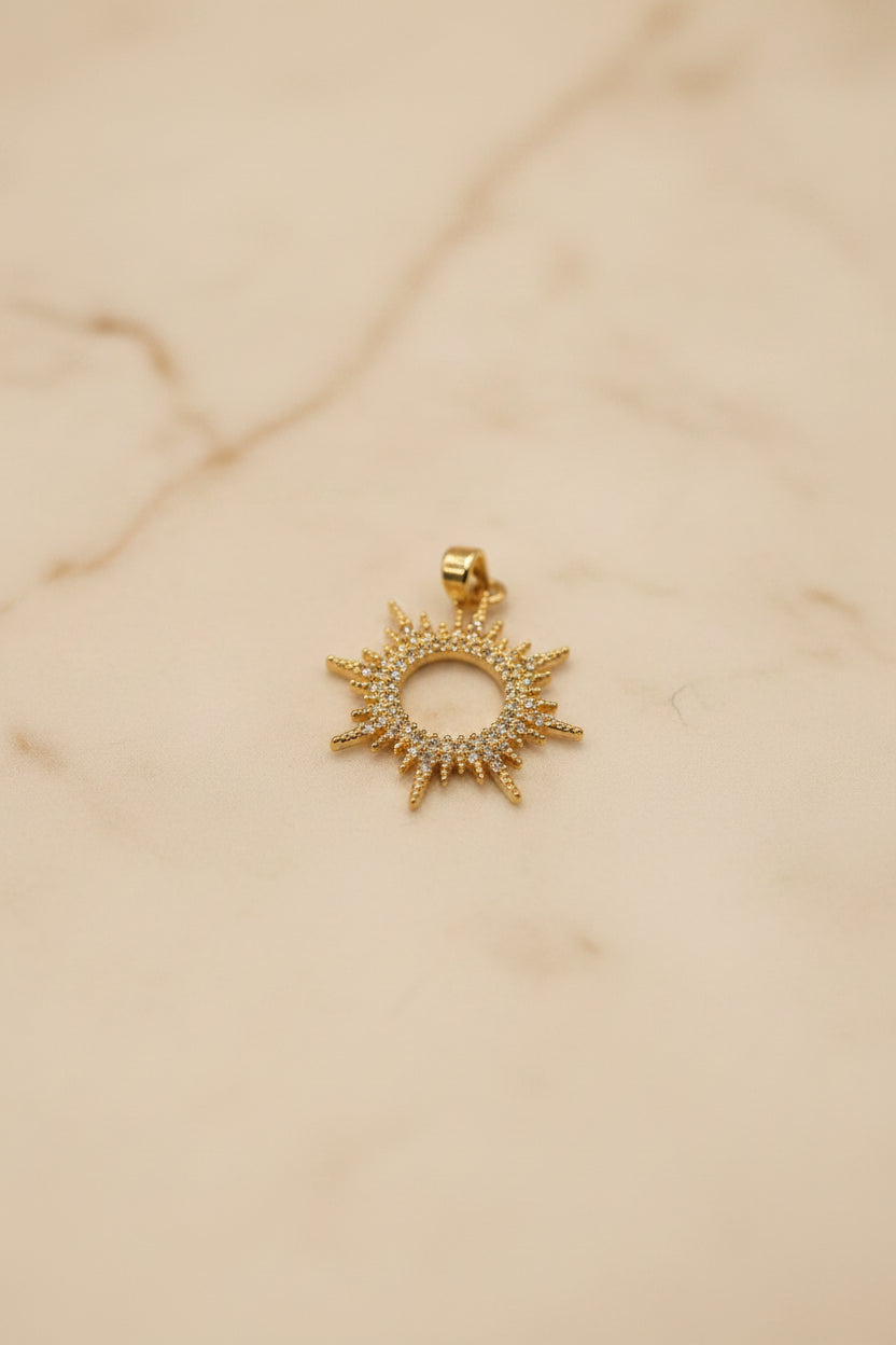 14K SUNBURST CHARM WITH CIRCULAR OPEN CENTER PENDANT