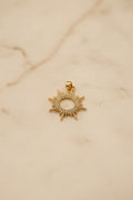 14K SUNBURST CHARM WITH CIRCULAR OPEN CENTER PENDANT