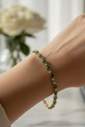 14K EMERALD AND DIAMOND TENNIS BRACELET