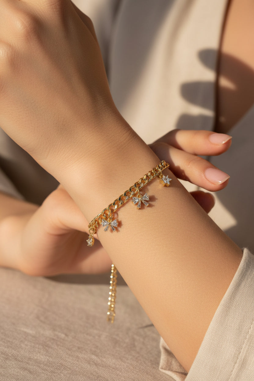 14K CURB LINK BRACELET WITH DANGLE BOWS RQ364